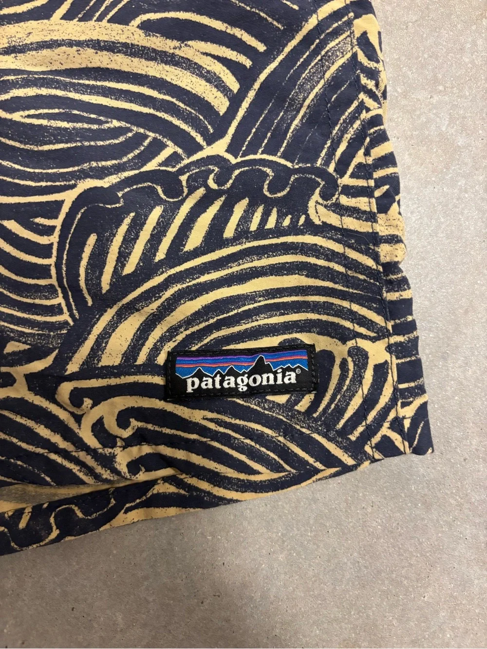 Patagonia x Common Threads Baggies Navy and Tan Wave-Print